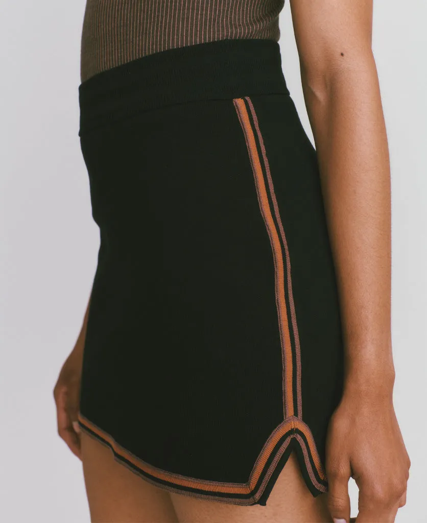 Certainly! Could you provide more details about the product or the existing title for the SYMBOL SKIRT? If you have any specific features or attributes that you want to highlight, such as fabric, style, color, or occasion, please let me know so I can help optimize the title effectively.