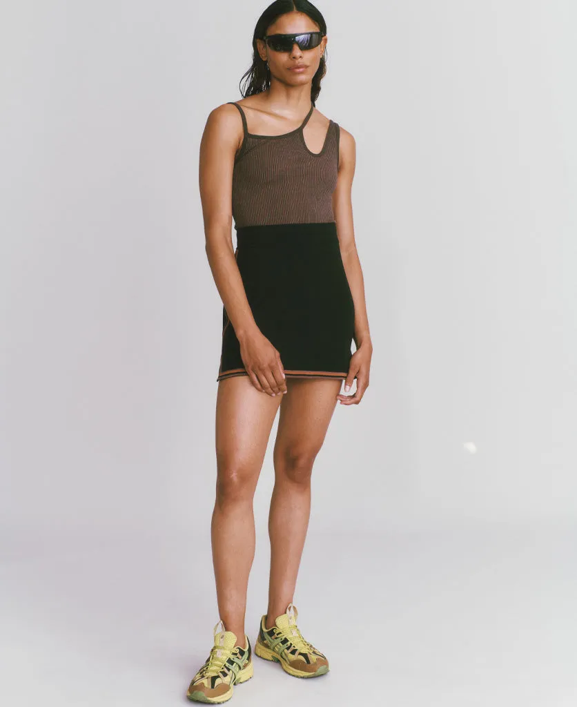 Certainly! Could you provide more details about the product or the existing title for the SYMBOL SKIRT? If you have any specific features or attributes that you want to highlight, such as fabric, style, color, or occasion, please let me know so I can help optimize the title effectively.