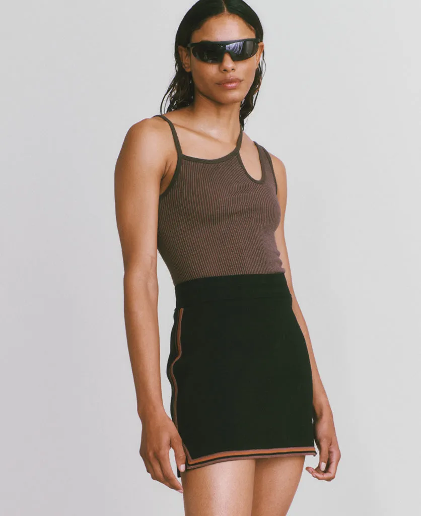 Certainly! Could you provide more details about the product or the existing title for the SYMBOL SKIRT? If you have any specific features or attributes that you want to highlight, such as fabric, style, color, or occasion, please let me know so I can help optimize the title effectively.